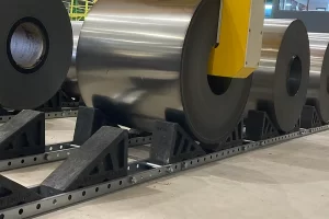 Close-up of adjustable plastic shoes and rail system for coil storage blocks