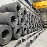 Steel coil stacking systems compared with traditional floor storage methods in an industrial steel warehouse