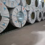 Modern metal warehousing facility using automated vehicles and advanced coil storage blocks for safe steel coil handling in 2026.