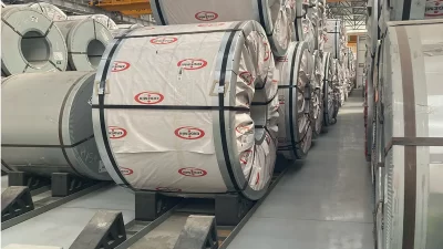 Comparison between high-strength steel and high-performance plastic coil saddles for industrial storage.